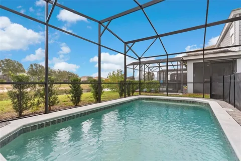 a swimming pool with an outdoor seating