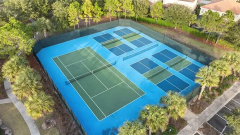 an aerial view of a house with yard swimming pool and outdoor seating
