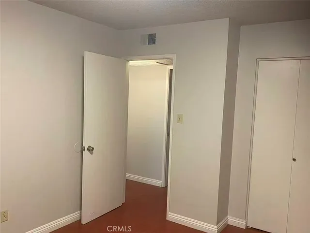 a view of a small space with wooden floor