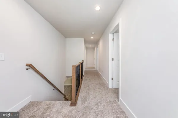 a view of a hallway with staircase