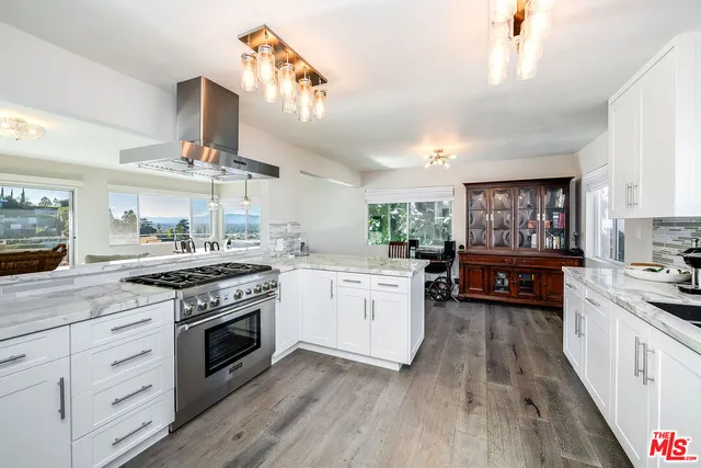 a kitchen with counter top space and a sink