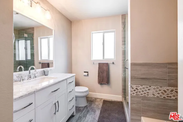 a bathroom with bathtub and shower