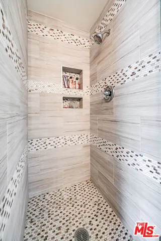 a reading room with wooden floor and furniture