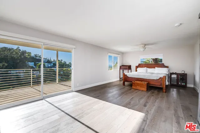 a room with furniture and a wooden floor