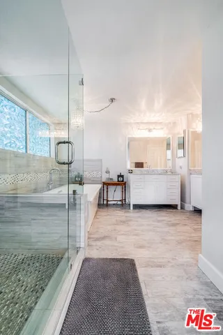 a bathroom with a bathtub and a sink