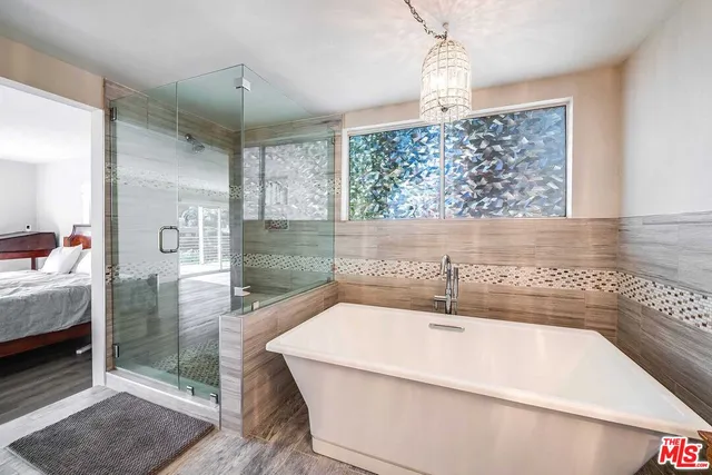 a bathroom with a granite countertop double vanity sink mirror and