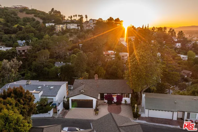 an aerial view of a house with lots of residential buildings