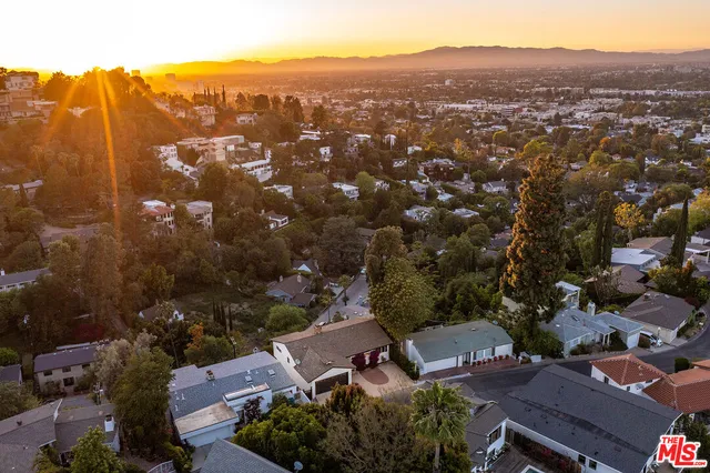 an aerial view of residential house and green space