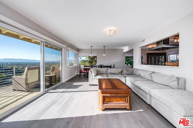 a view of a balcony with chairs