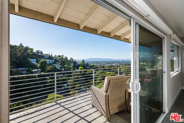 a view of balcony with furniture