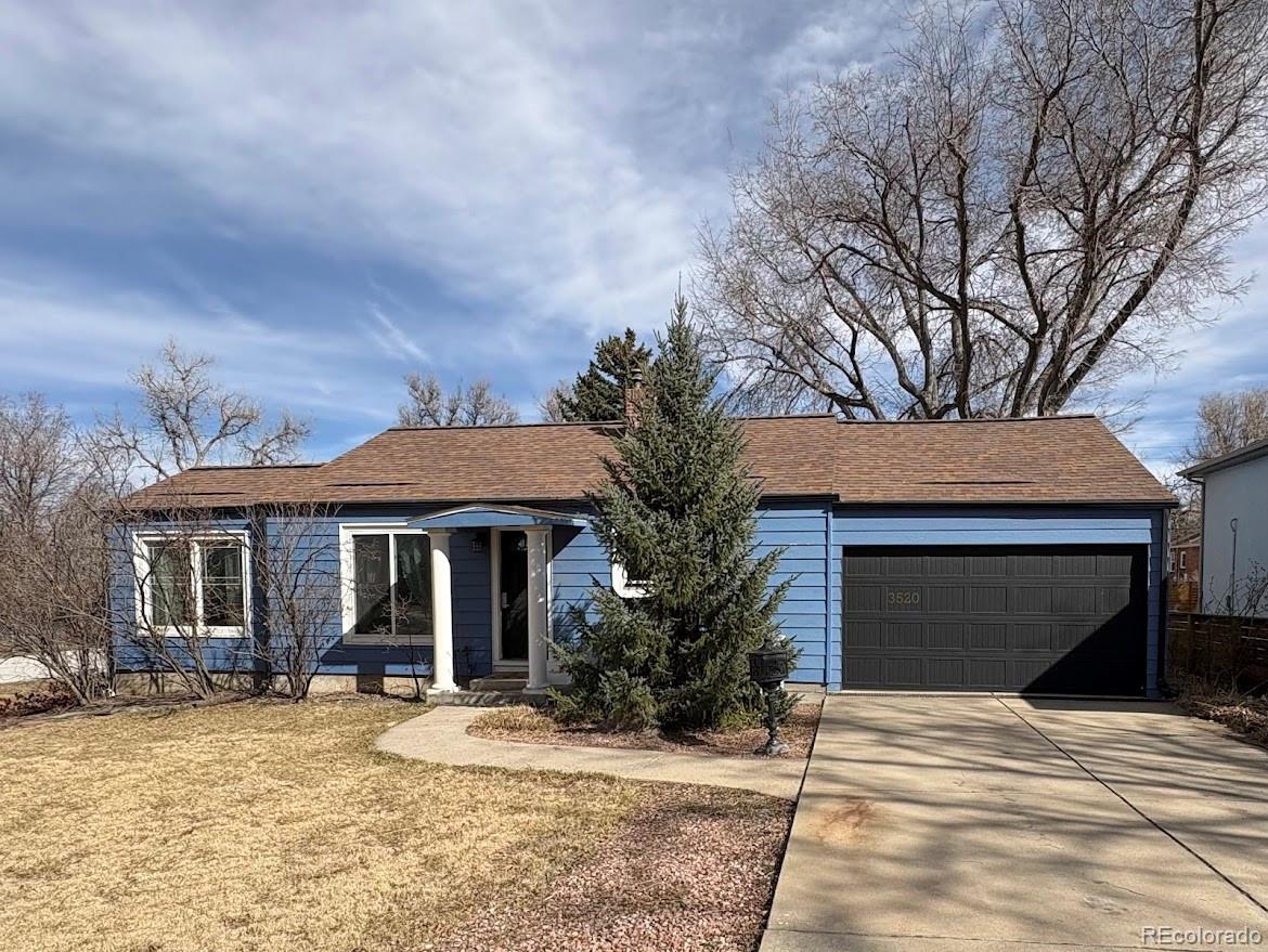 3520 High Court Wheat Ridge, CO 80033 - Photo 14 of 14 a front view of a house with a yard and garage
