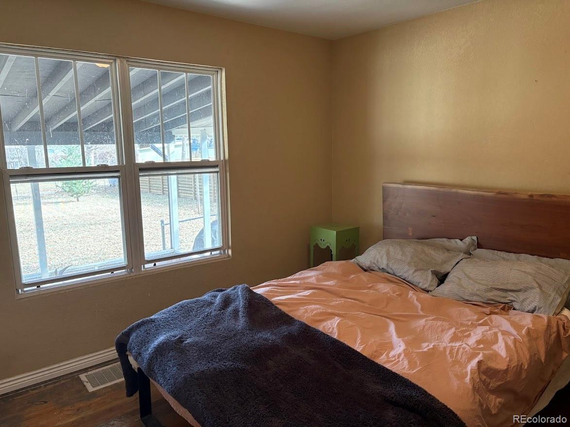 3520 High Court Wheat Ridge, CO 80033 - Photo 8 of 14 a bedroom with a bed and a window