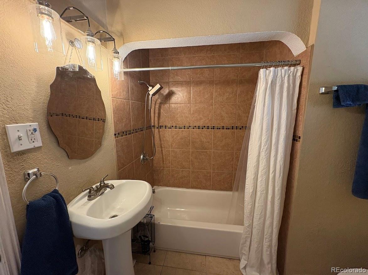 3520 High Court Wheat Ridge, CO 80033 - Photo 9 of 14 a bathroom with a sink toilet and shower