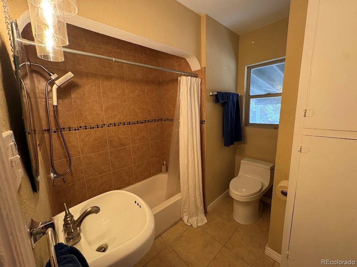 3520 High Court Wheat Ridge, CO 80033 - Photo 10 of 14 a bathroom with a toilet and a shower