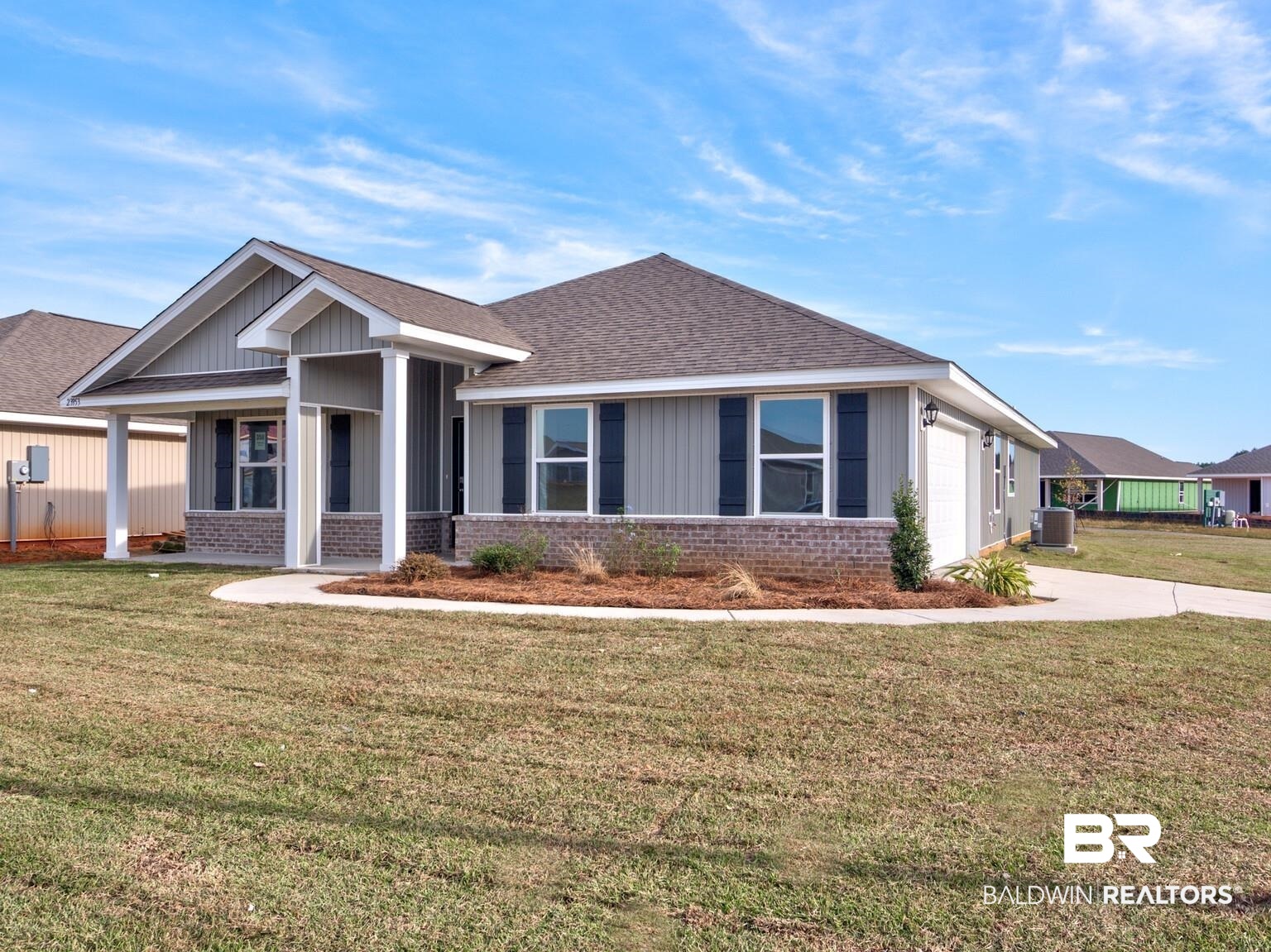 23953 Citation Loop Daphne, AL 36526 - Photo 3 of 49 Ranch-style house featuring brick siding, a front lawn, covered porch, and roof with shingles