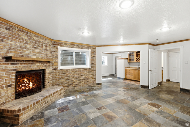 3535 Homestead Road Park City, UT 84098 - Photo 47 of 81 Brick accent wall featuring a wood-mantle fireplace
