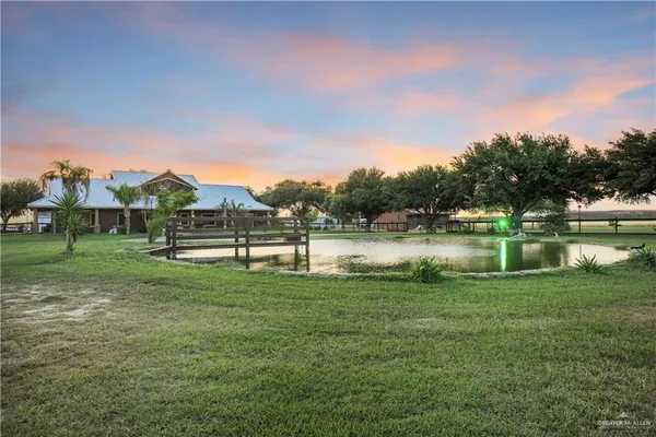 a view of lake with houses in the back