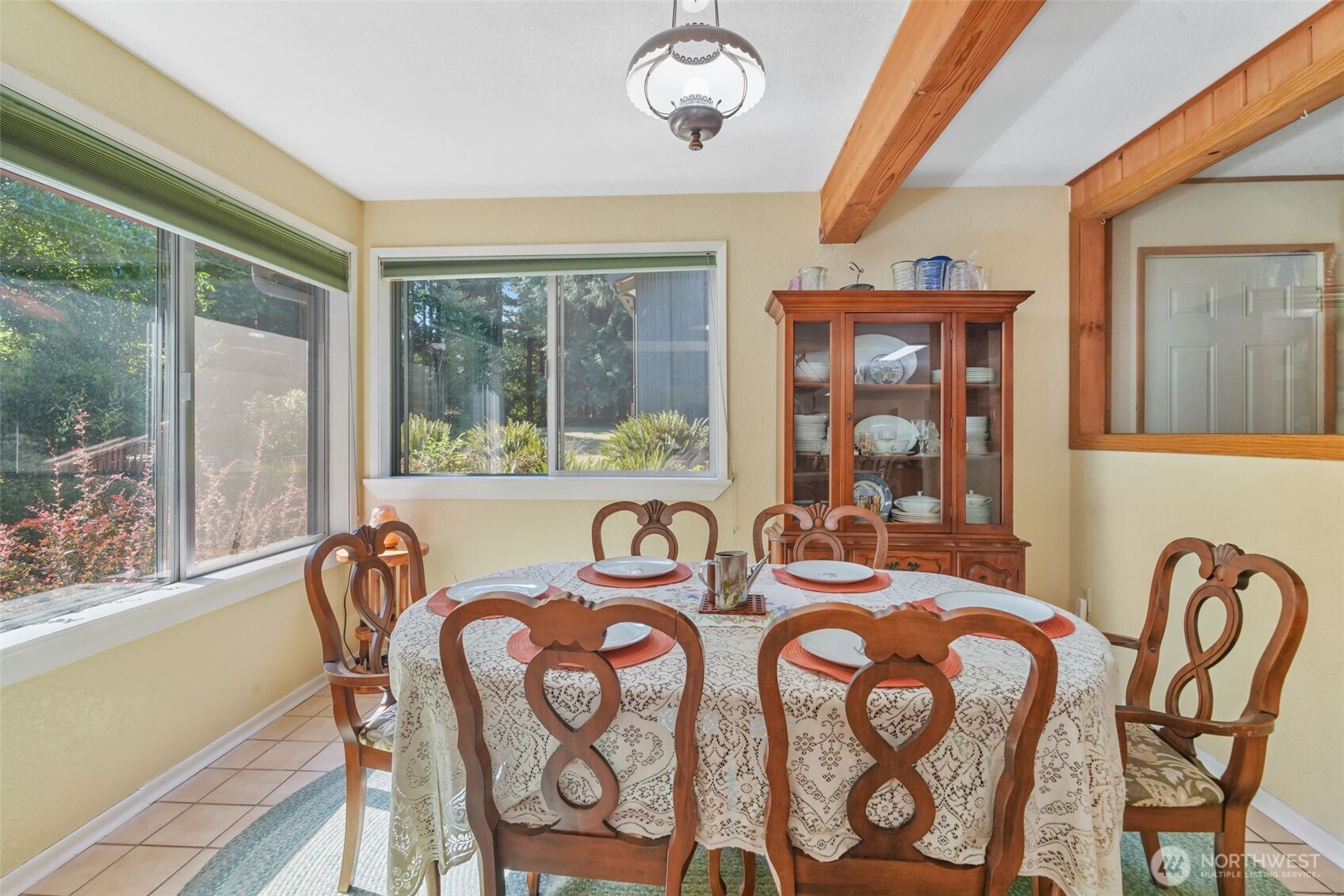 8815 Prather Road Southwest Centralia, WA 98531 - Photo 11 of 40 a view of a dining room with furniture a chandelier and wooden floor