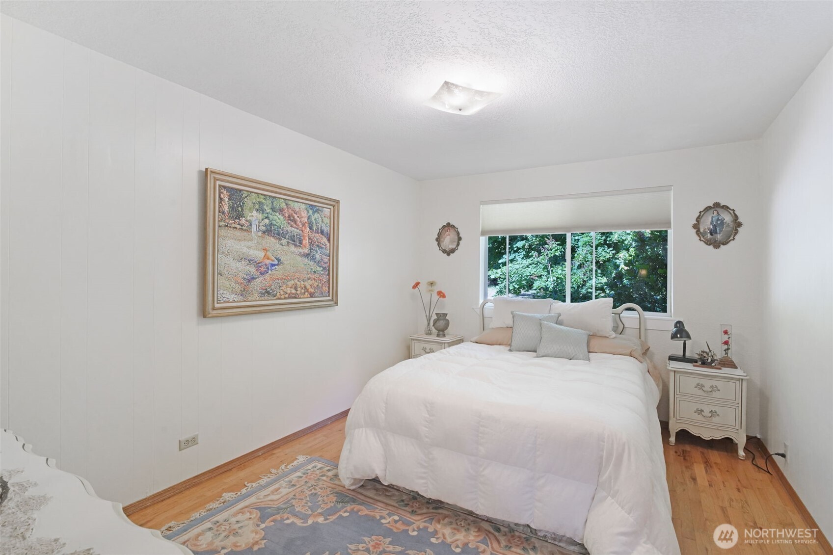 8815 Prather Road Southwest Centralia, WA 98531 - Photo 13 of 40 a bedroom with a bed and a painting on the wall