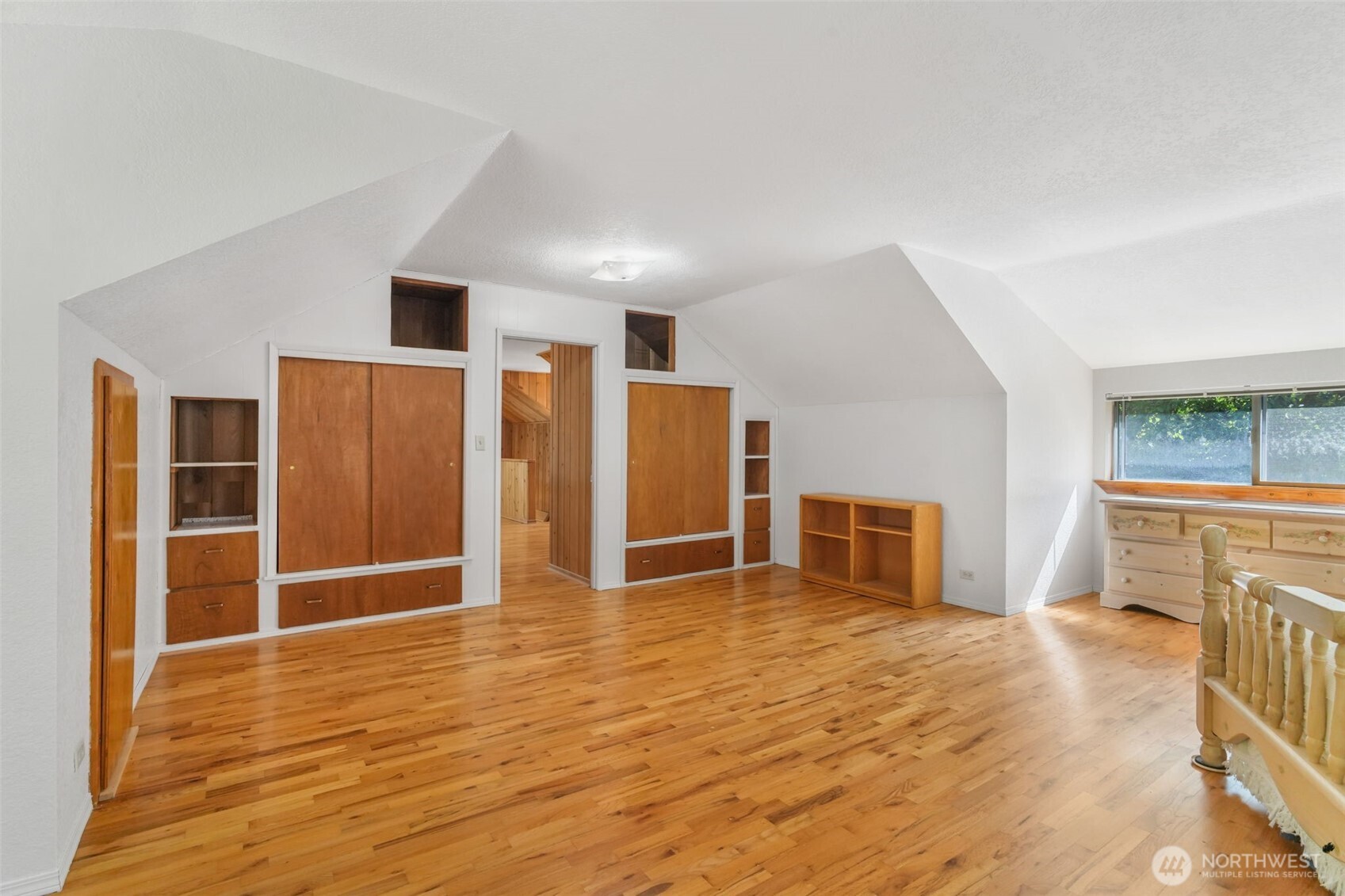 8815 Prather Road Southwest Centralia, WA 98531 - Photo 27 of 40 a view of an empty room with wooden floor and a window
