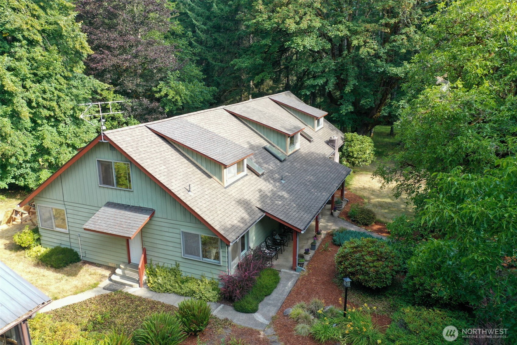 8815 Prather Road Southwest Centralia, WA 98531 - Photo 4 of 40 a aerial view of a house with a yard and large trees