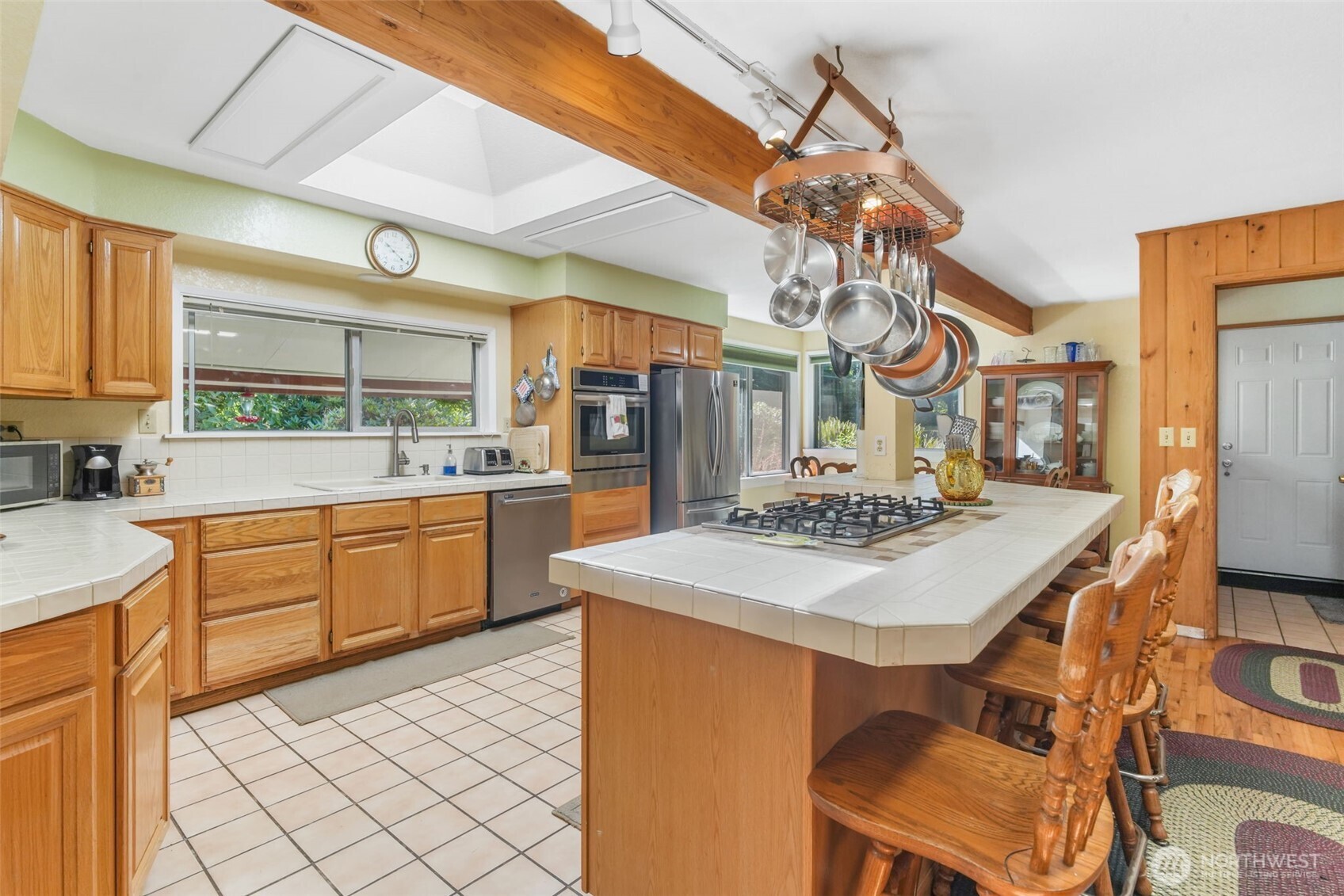 8815 Prather Road Southwest Centralia, WA 98531 - Photo 8 of 40 a kitchen with a table chairs stove and cabinets