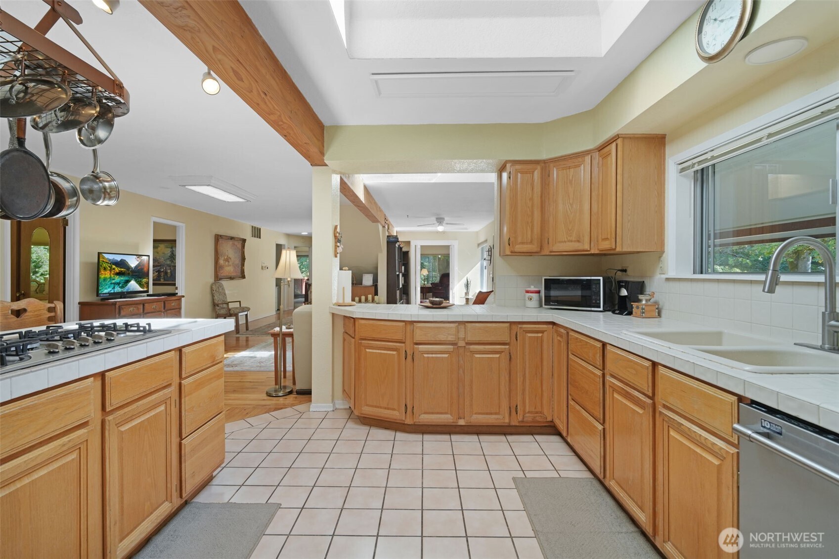 8815 Prather Road Southwest Centralia, WA 98531 - Photo 9 of 40 a kitchen with a sink dishwasher stove and cabinets