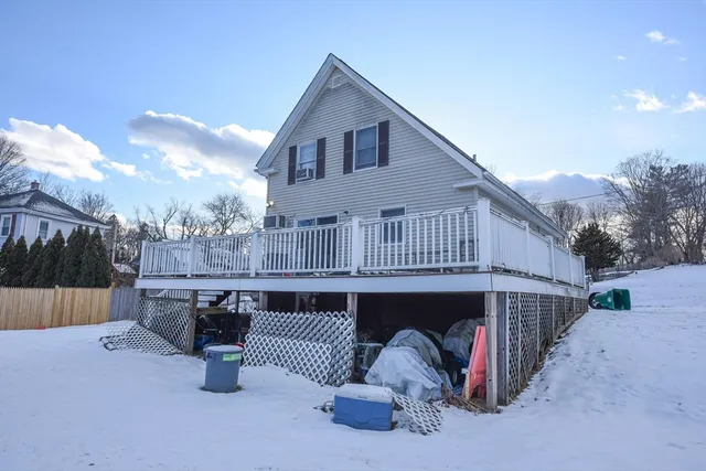 a view of a house with a snow in the yard