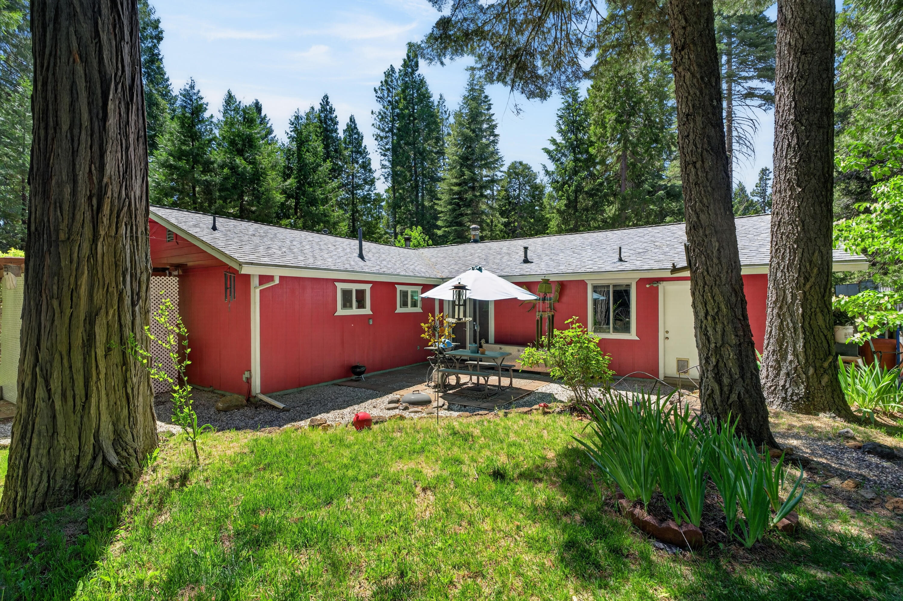 8015 Starlite Pines Road Shingletown, CA 96088 - Photo 30 of 38 a view of a house with garden