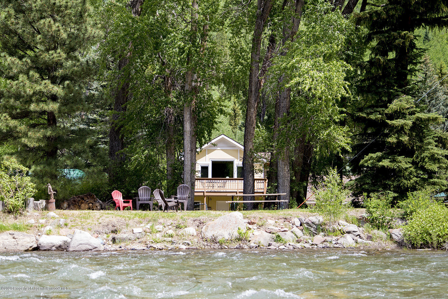 a front view of a house with a small yard