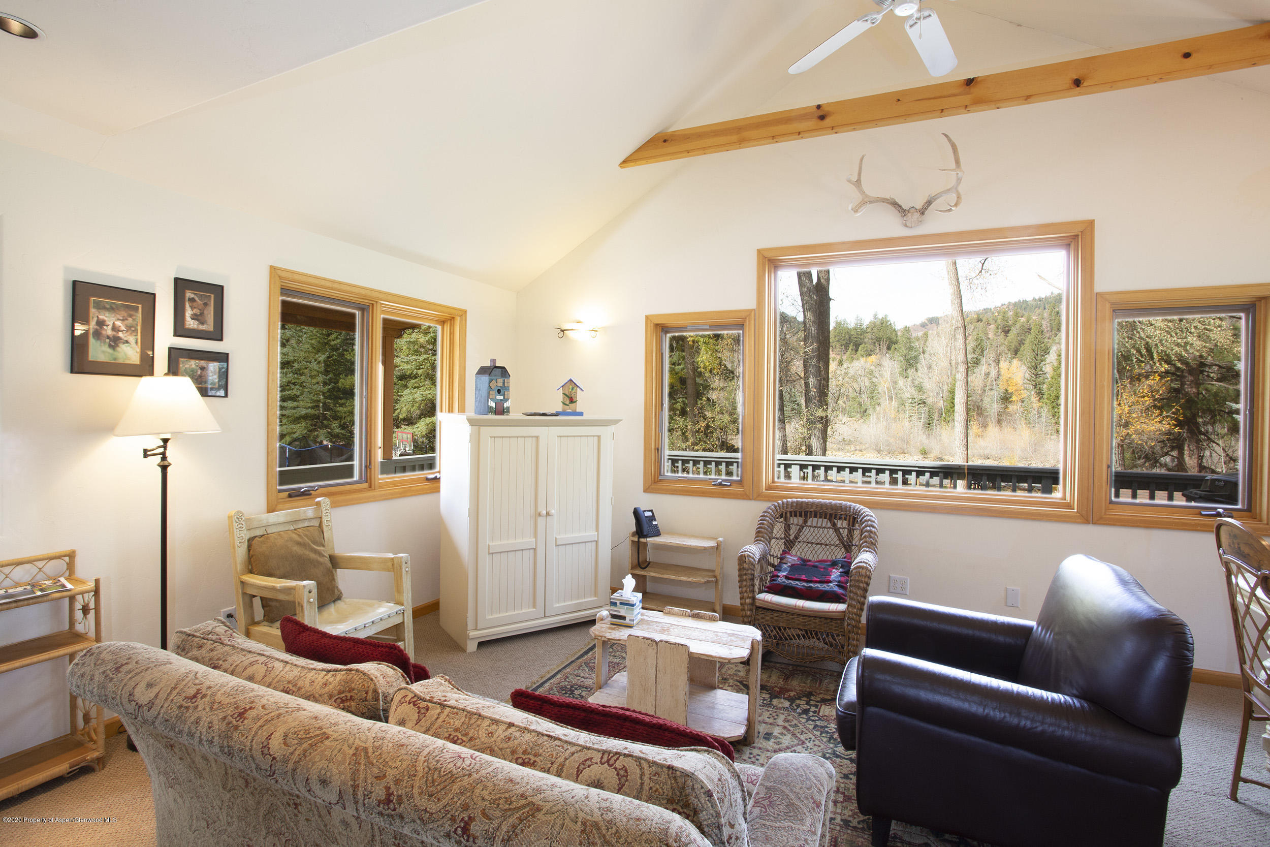 385 Redstone Boulevard Redstone, CO 81623 - Photo 11 of 36 a living room with furniture and a large window