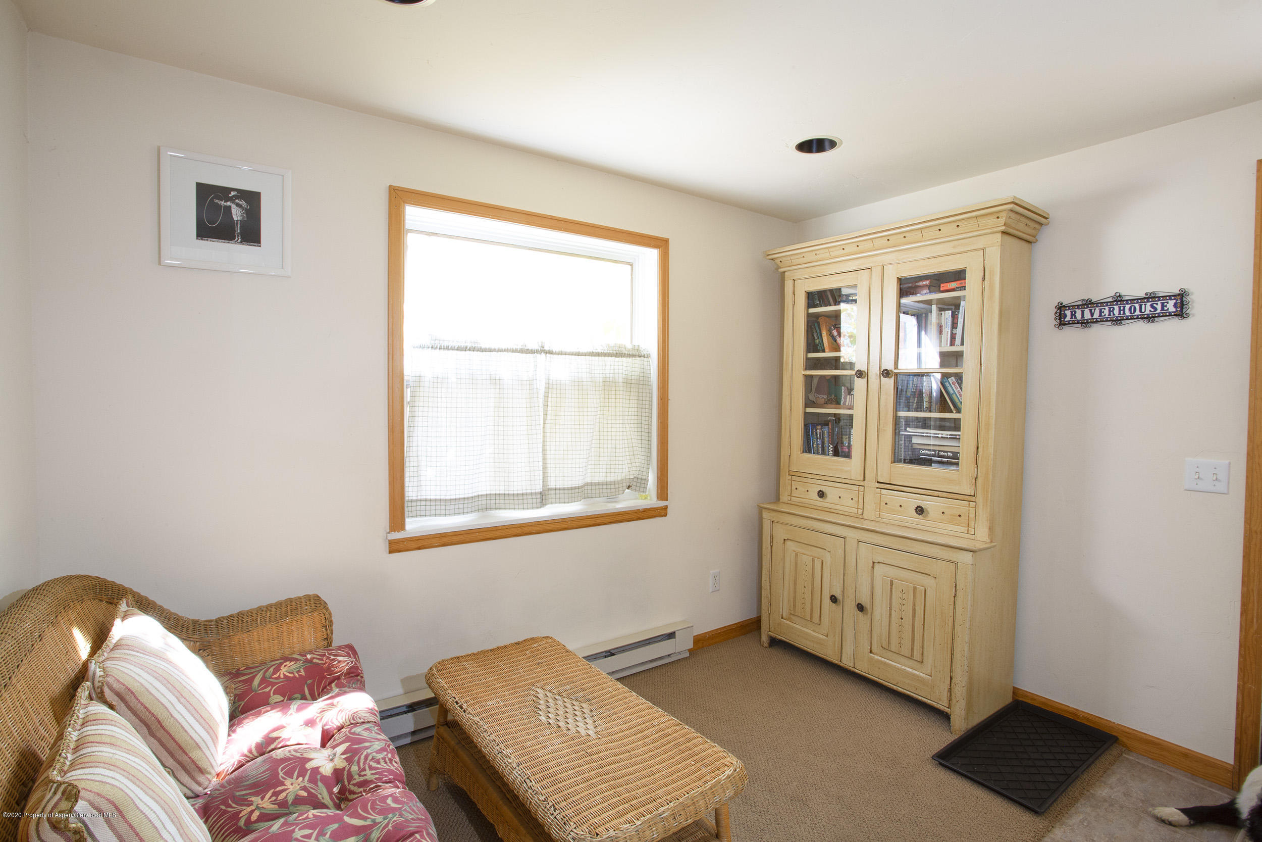 385 Redstone Boulevard Redstone, CO 81623 - Photo 19 of 36 a bedroom with a bed and wooden floor
