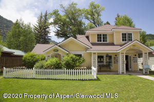 385 Redstone Boulevard Redstone, CO 81623 - Photo 2 of 36 a front view of a house with a garden