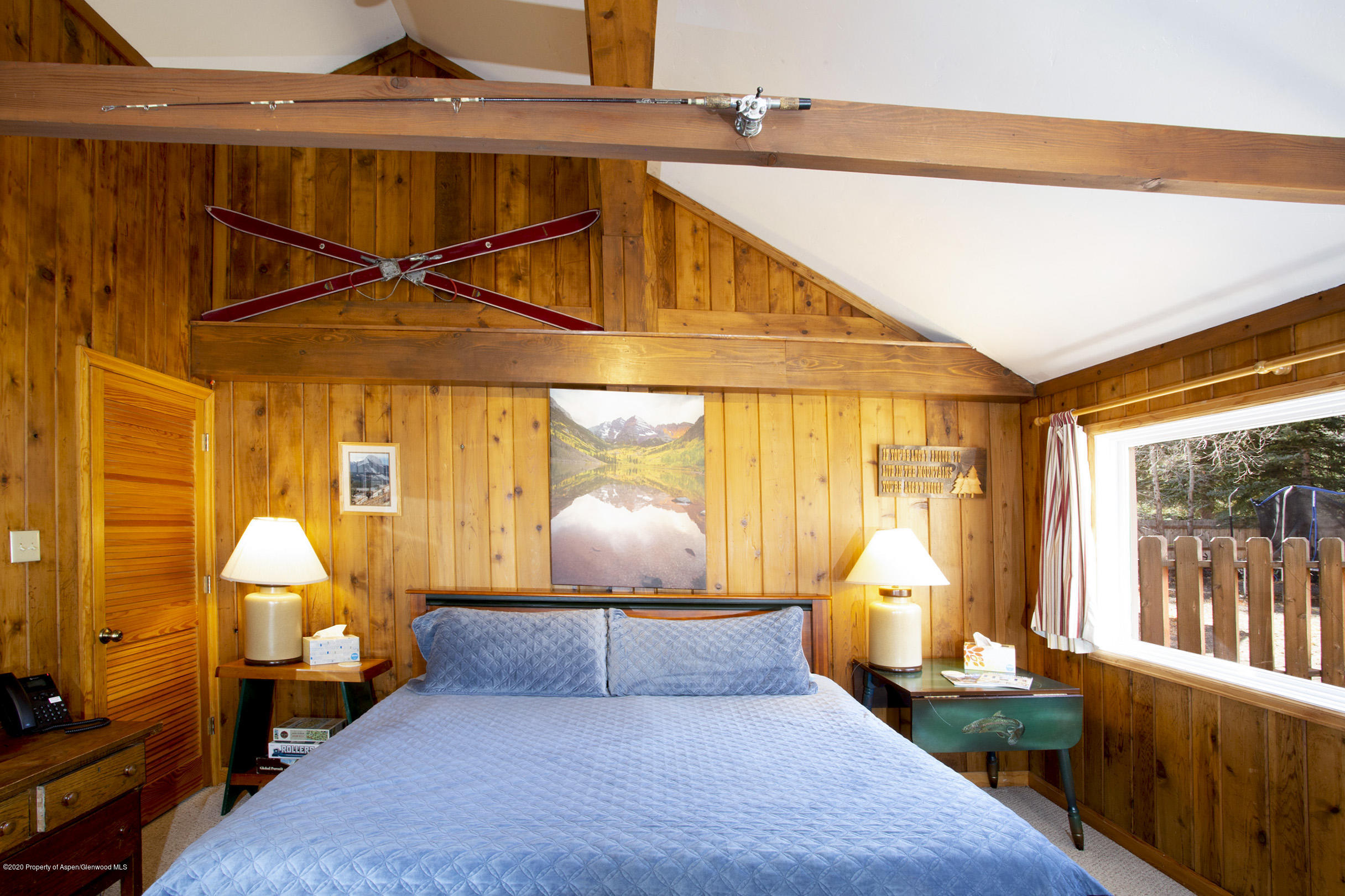 385 Redstone Boulevard Redstone, CO 81623 - Photo 22 of 36 a bedroom with furniture and large windows