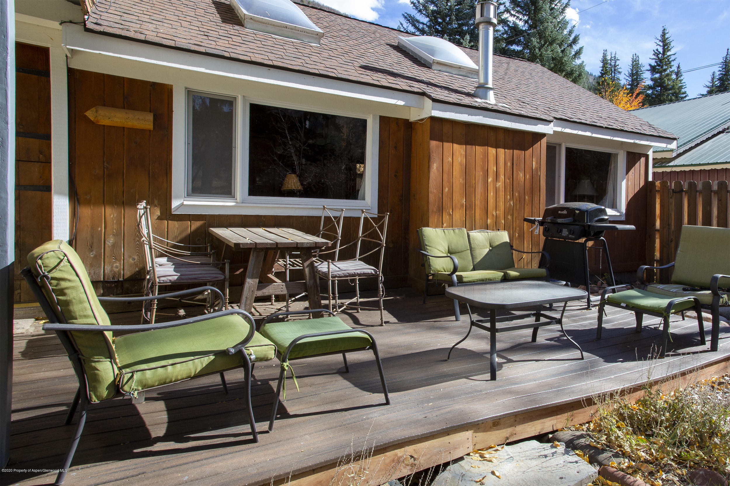 385 Redstone Boulevard Redstone, CO 81623 - Photo 26 of 36 a backyard of a house with outdoor seating