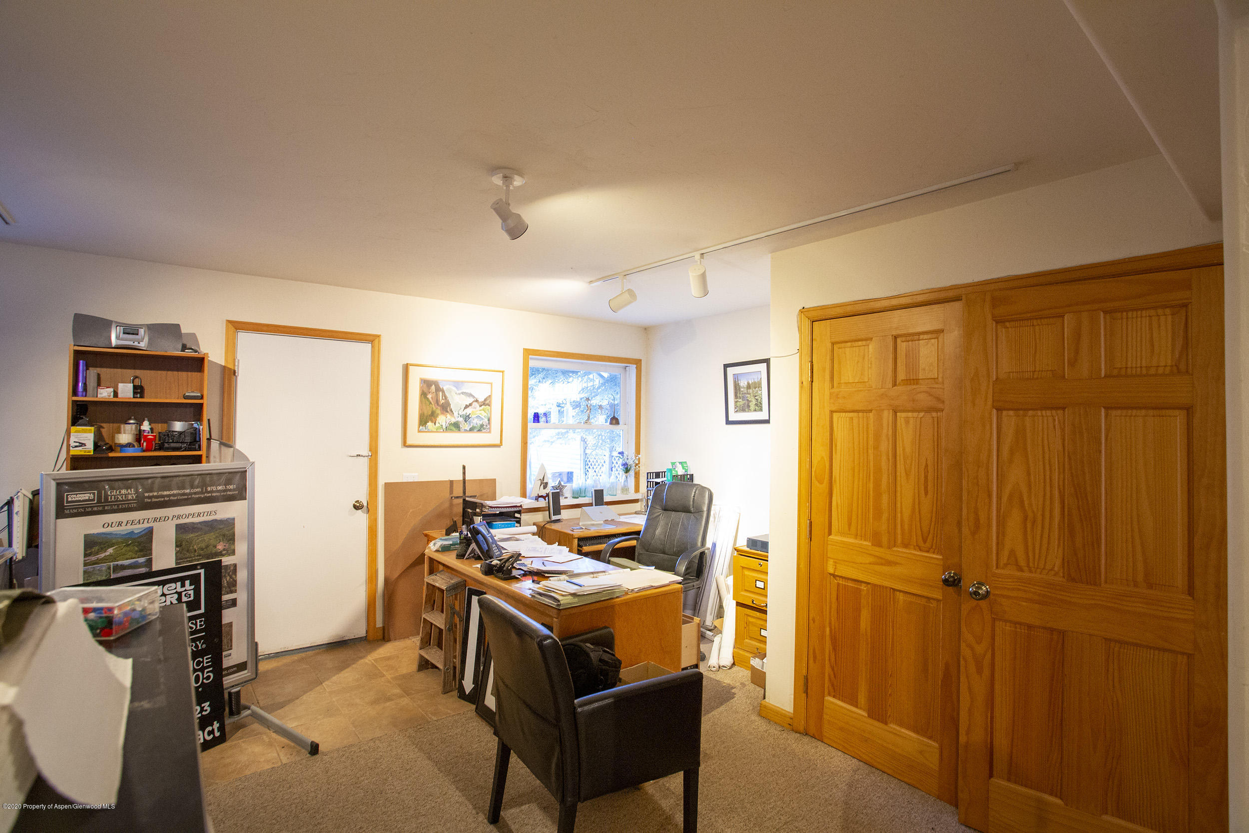 385 Redstone Boulevard Redstone, CO 81623 - Photo 28 of 36 a bedroom with a bed and wooden floor