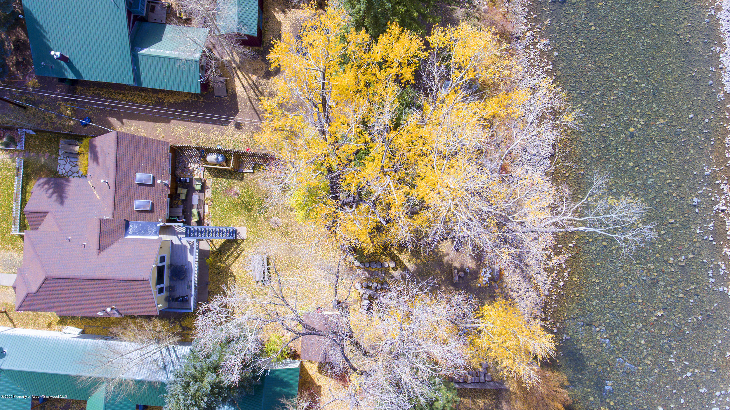 385 Redstone Boulevard Redstone, CO 81623 - Photo 3 of 36 a yellow building with trees in front of it
