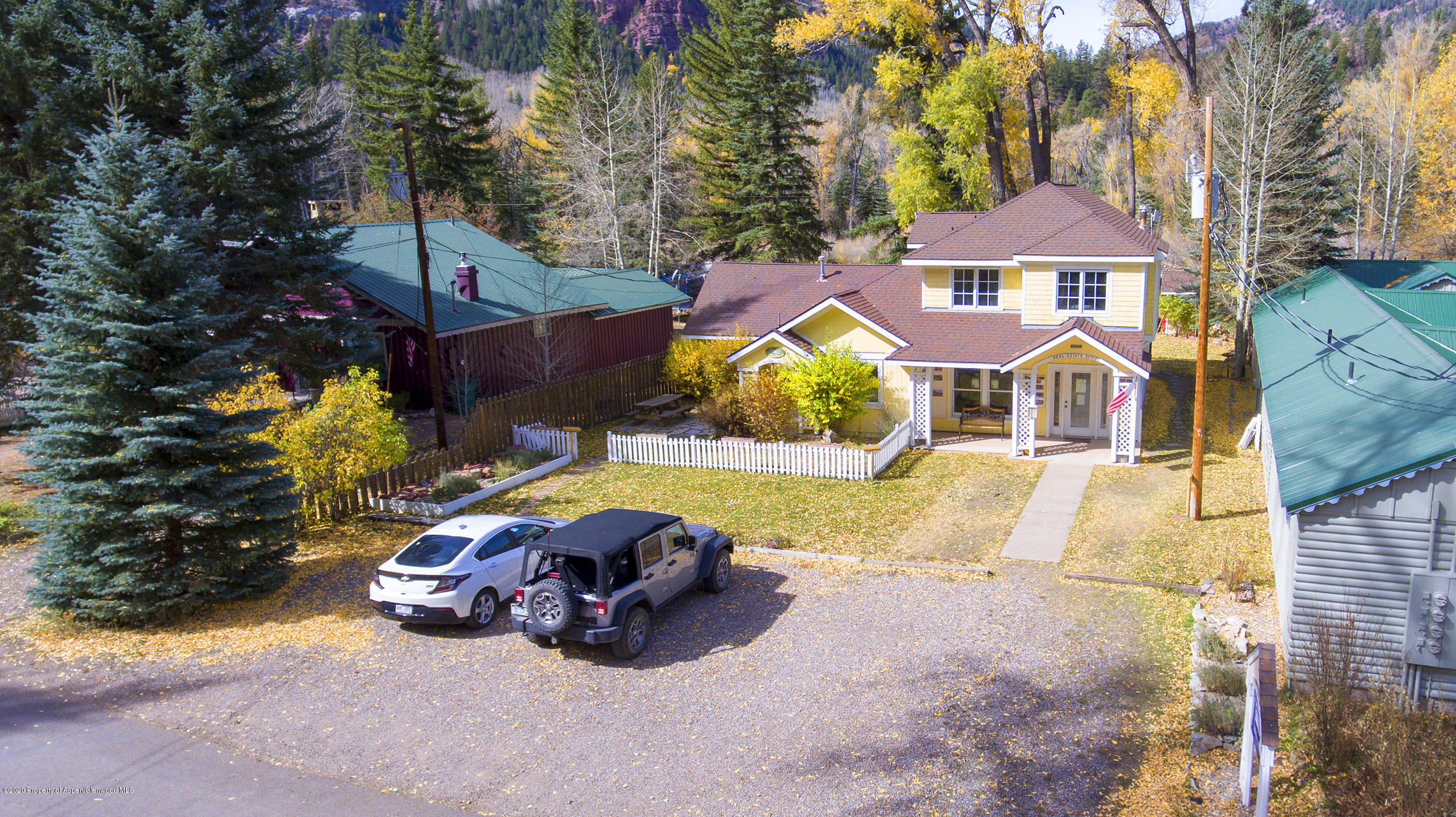 385 Redstone Boulevard Redstone, CO 81623 - Photo 6 of 36 a view of swimming pool with lounge chair and dinning table under an umbrella
