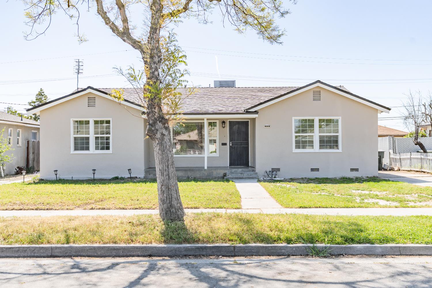535 West Terrace Avenue Fresno, CA 93705 - Photo 1 of 18 a view of a swimming pool with an outdoor space and seating area