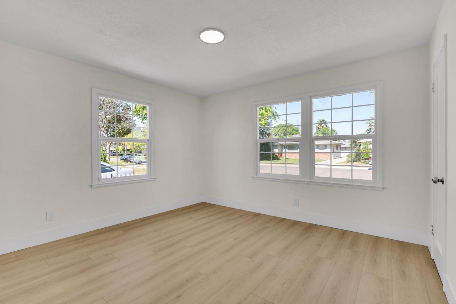 535 West Terrace Avenue Fresno, CA 93705 - Photo 5 of 18 a view of an empty room with a window