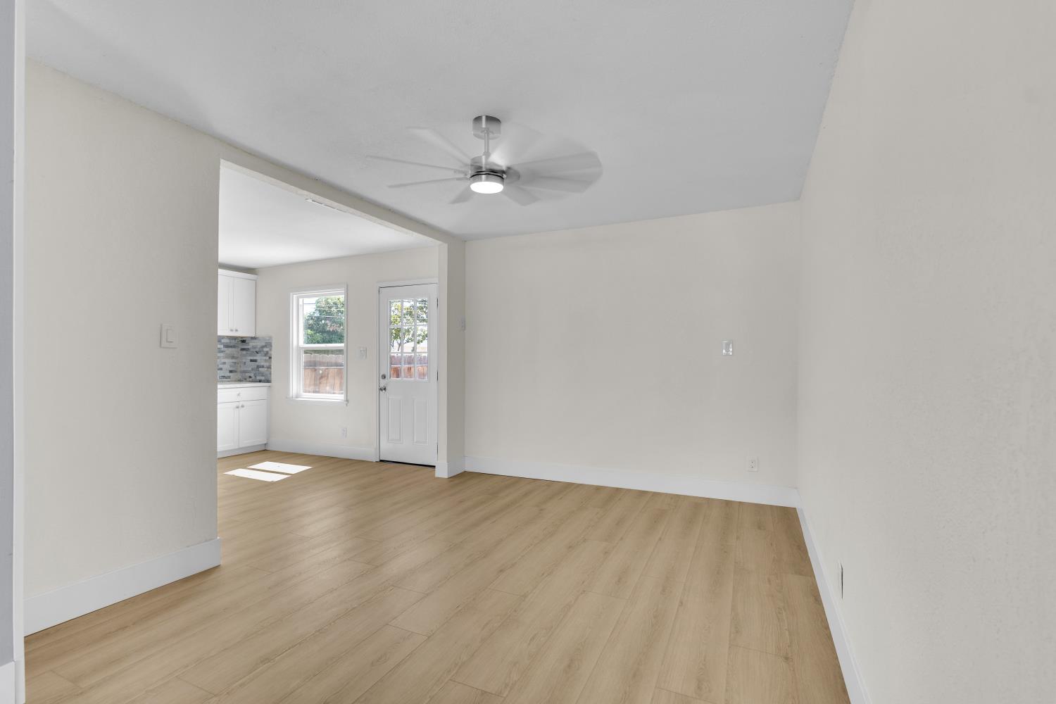 535 West Terrace Avenue Fresno, CA 93705 - Photo 10 of 18 wooden floor in an empty room with a window