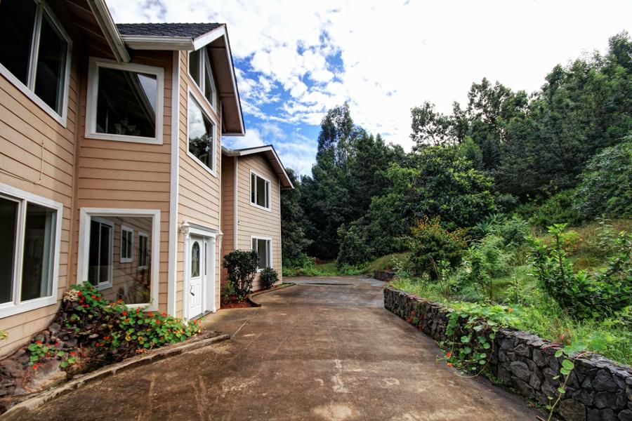 729 Alae Road Kula, HI 96790 - Photo 26 of 30 a view of a house with a yard and potted plants