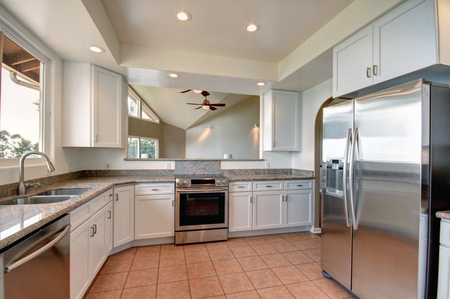 729 Alae Road Kula, HI 96790 - Photo 4 of 30 a kitchen with a sink stainless steel appliances and cabinets