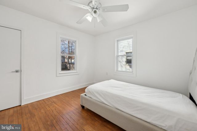 a bathroom with a tub toilet sink and mirror