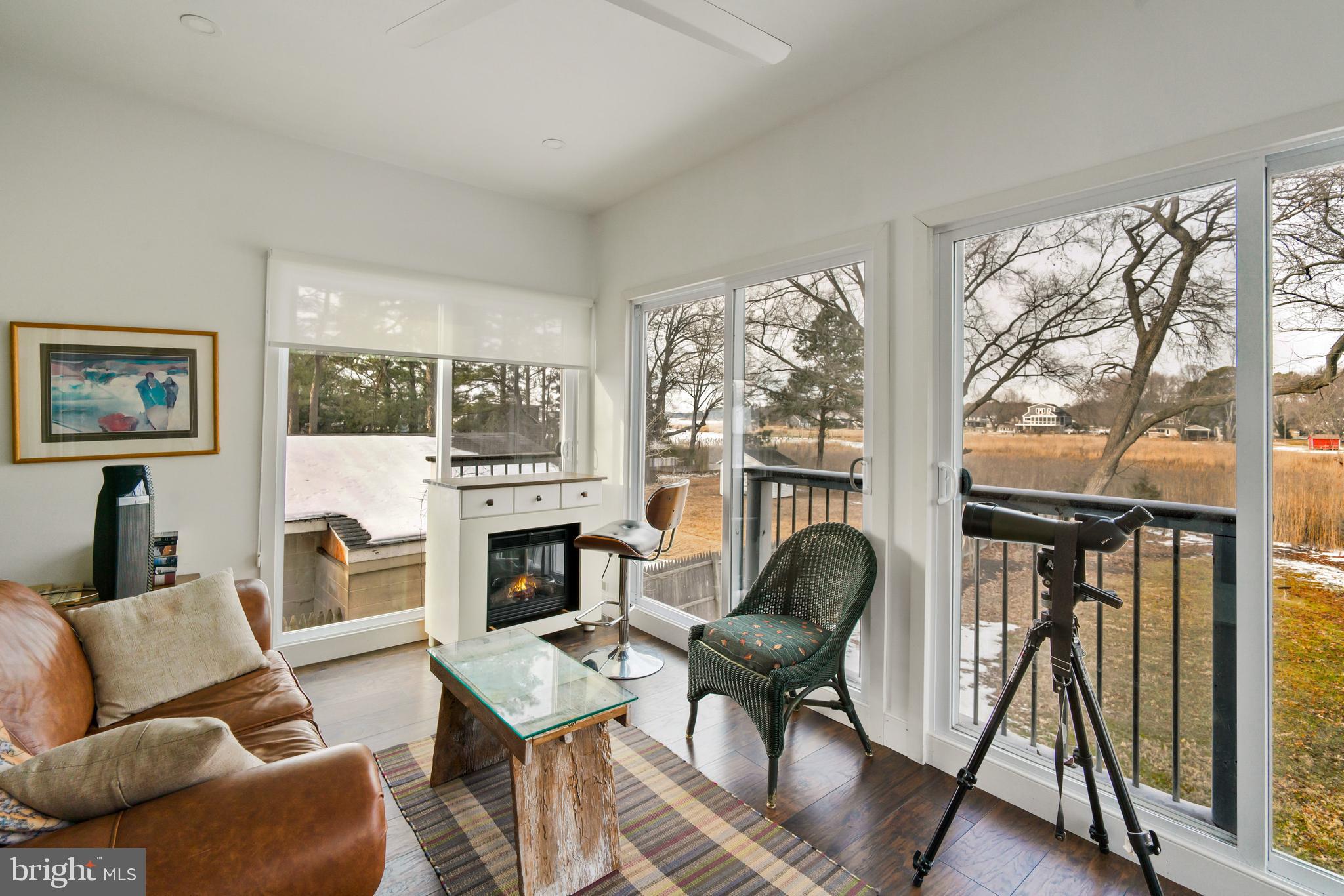 21026 Rock Hall Avenue Rock Hall, MD 21661 - Photo 13 of 34 Sun room off living room overlooks the water