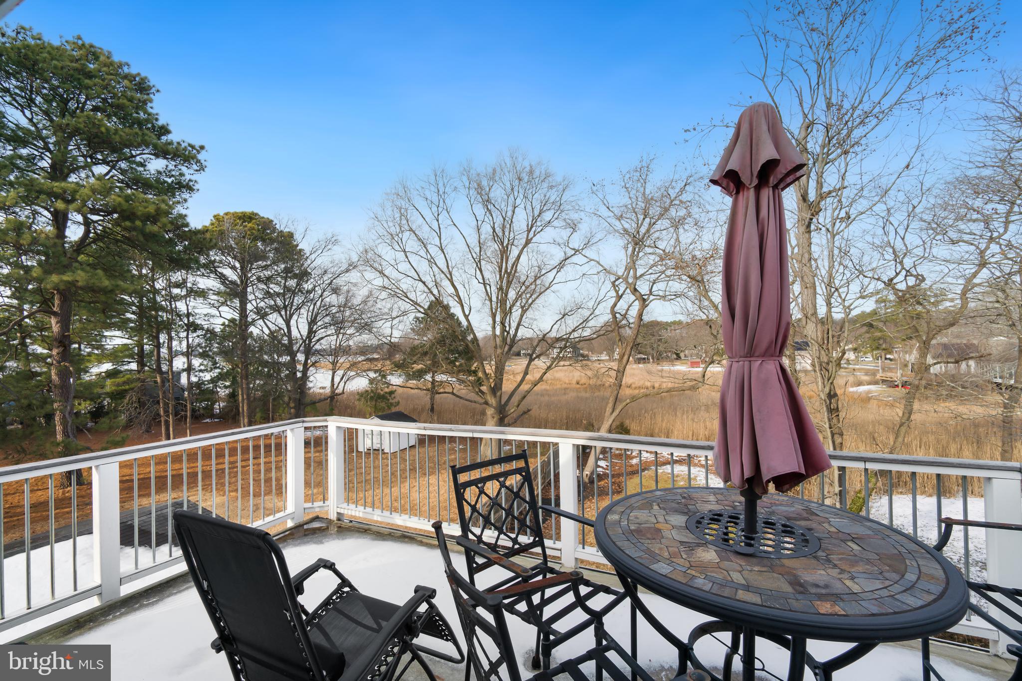 21026 Rock Hall Avenue Rock Hall, MD 21661 - Photo 17 of 34 Water view deck off bedroom #2