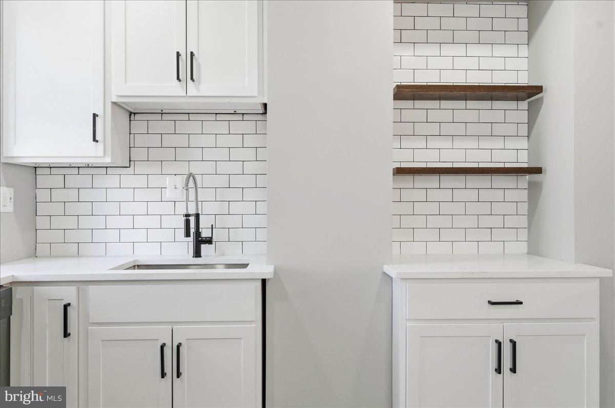 3414 Harford Road Baltimore, MD 21218 - Photo 15 of 32 a bathroom with a sink and a bathtub