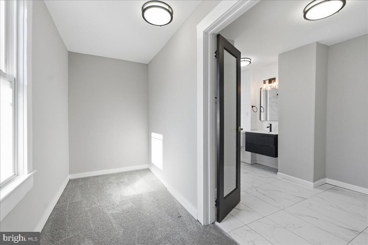 3414 Harford Road Baltimore, MD 21218 - Photo 19 of 32 a view of a hallway with closet area