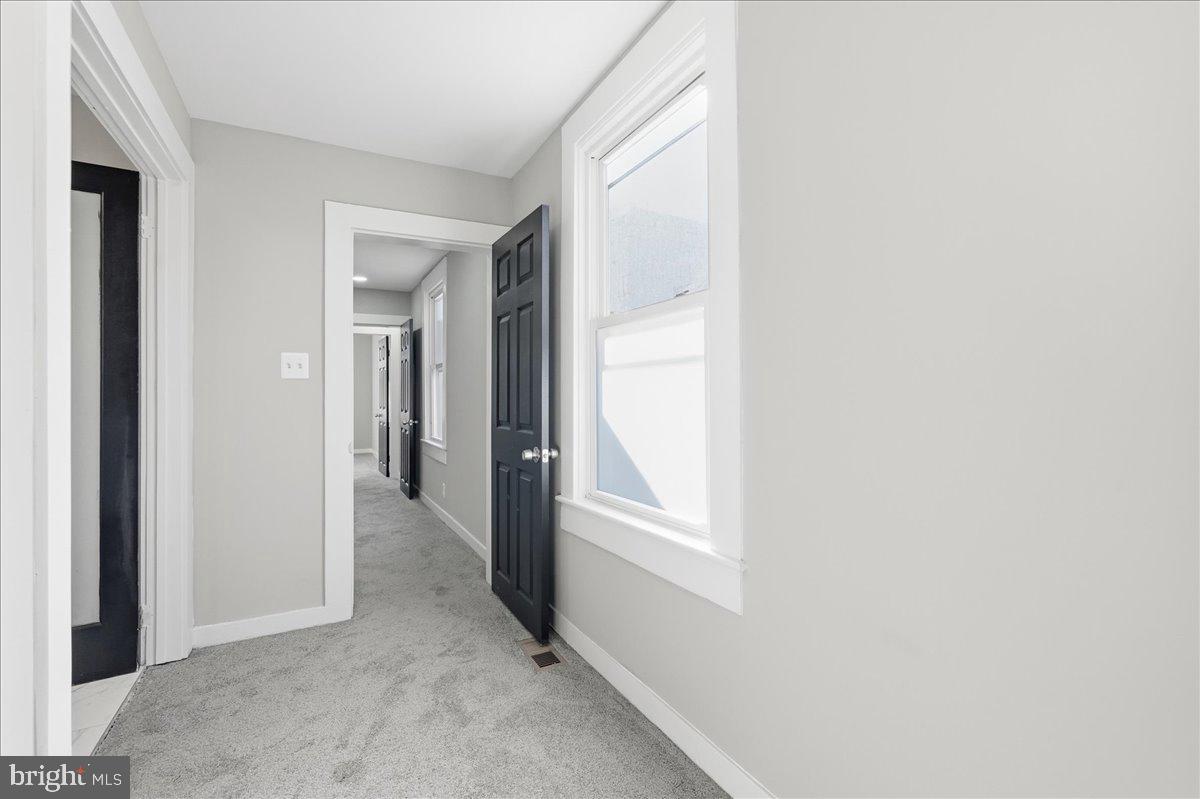 3414 Harford Road Baltimore, MD 21218 - Photo 20 of 32 a view of an empty room with closet and a window