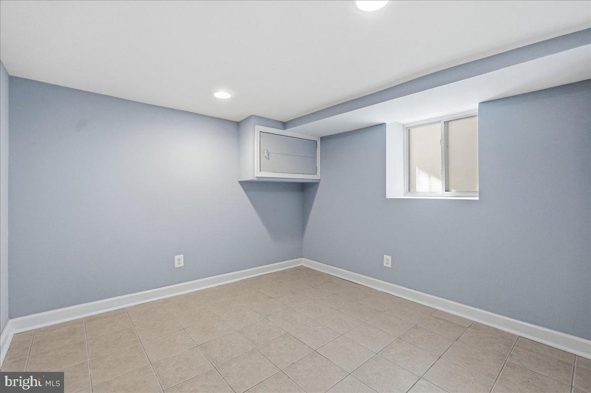 3414 Harford Road Baltimore, MD 21218 - Photo 22 of 32 an empty room with a empty space and windows